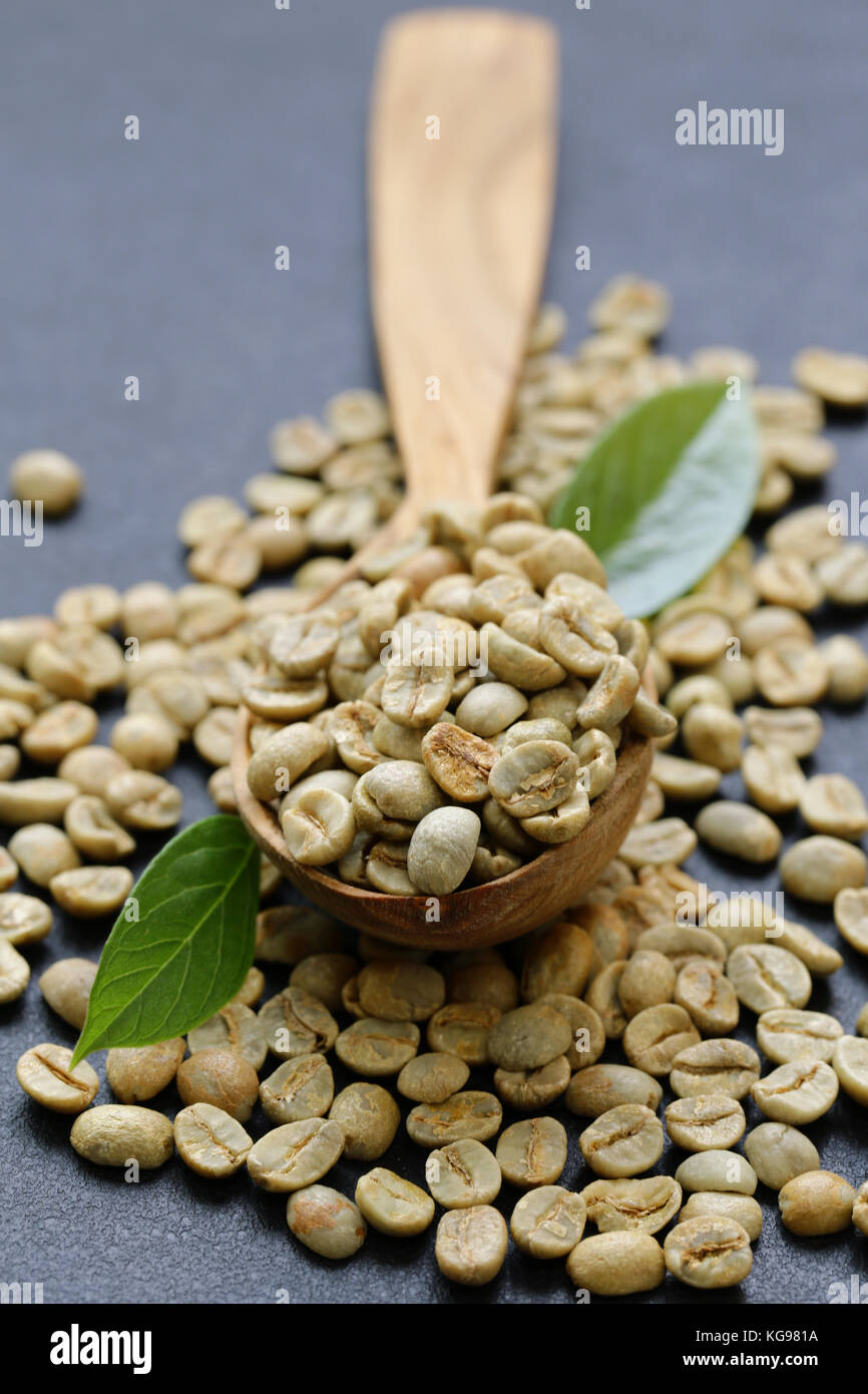 natural organic green coffee beans on a black background Stock Photo