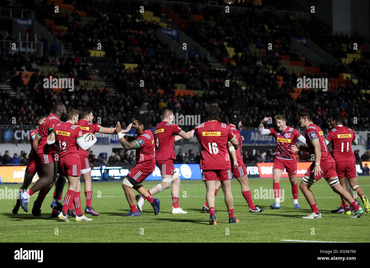 Harlequins players celebrate as the winning try is awarded by the TMO during the Anglo Welsh Cup match at Allianz Park, London. Stock Photo