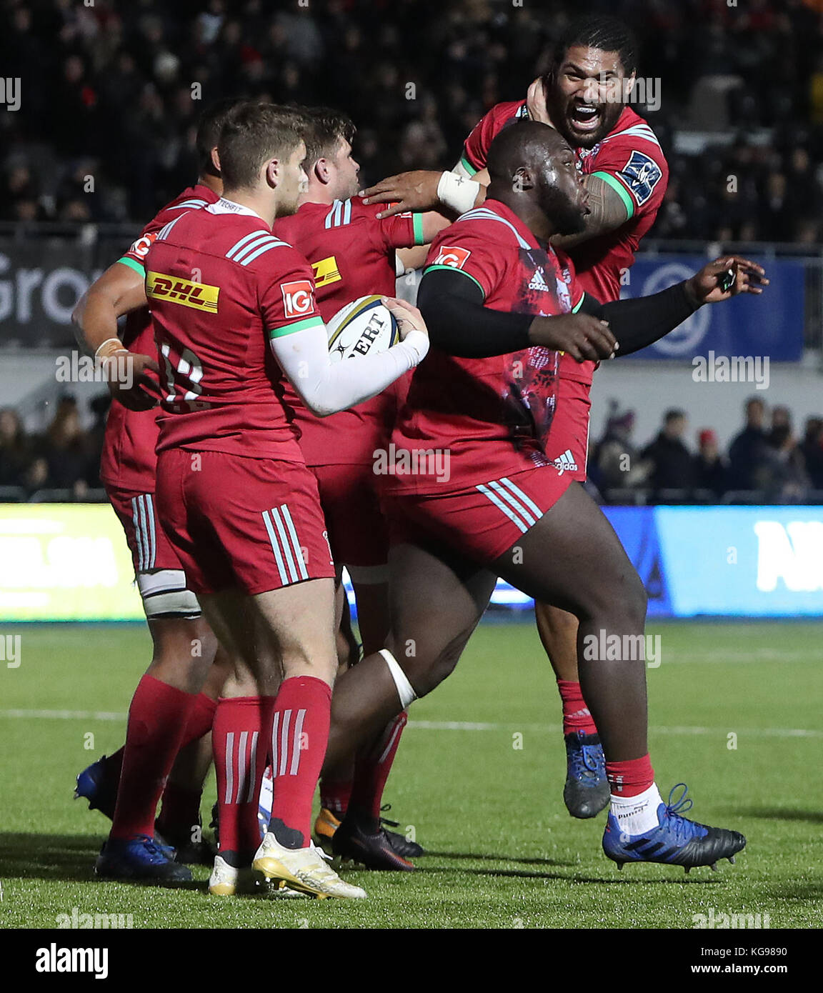 Harlequins Josh Ibuanokpe celebrates with team mates as the winning try is awarded by the TMO during the Anglo Welsh Cup match at Allianz Park, London. Stock Photo