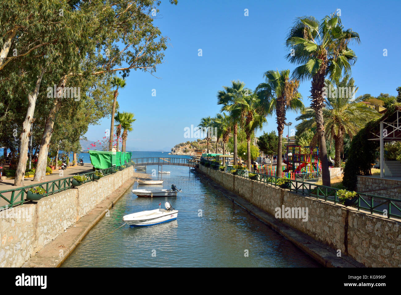 Turunc, Mugla, Turkey - October 9, 2016. Canal in Turunc suburb of Marmaris restory town in Turkey, with boats and vegetation. Stock Photo