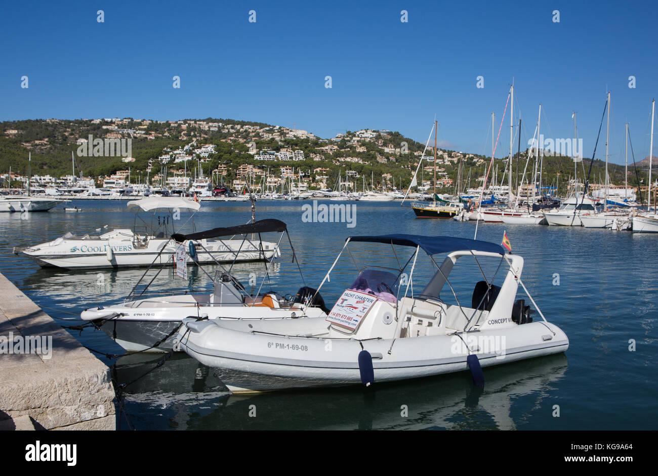 Yacht and boats moored at harbour, mountains in background, Port d' Andratx, Majorca, Balearic Islands, Spain. Stock Photo
