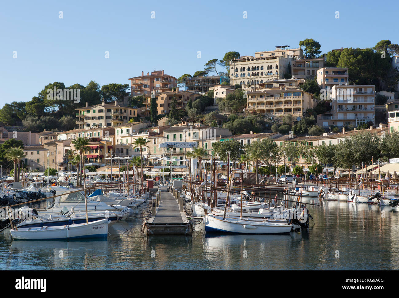 Boats moored at harbour, town in background, Andratx, Majorca, Balearic Islands, Spain. Stock Photo