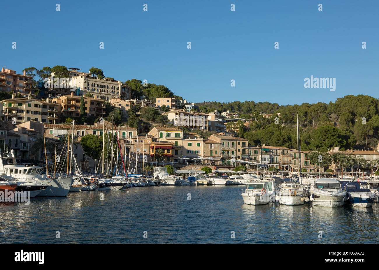 Boats moored at harbour, town in background, Port de Soller, Majorca, Balearic Islands, Spain. Stock Photo