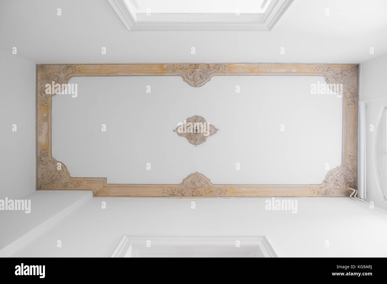 Exposed stucco ceiling in old building after renovation - Stock Photo