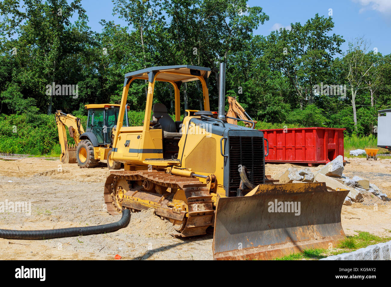 new construction tractor excavators and garbage containers waste in the ...