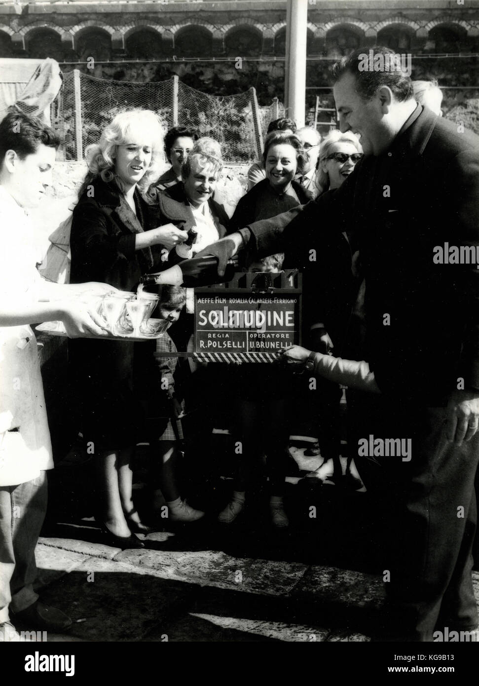 Film director Renato Polselli toasting during filming Solitudine, 1961 Italy Stock Photo