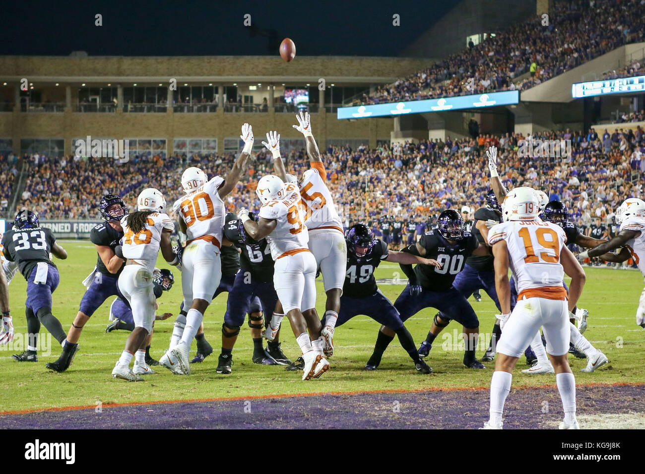 Fort Worth, Texas, USA. 4th Nov, 2017. University of Texas DL Charles Omenihu (90) and University of Texas DL Chris Nelson (97) and University of Texas DL Poona Ford (95) attempt to block and extra point try during the game between The University of Texas and Texas Christian University at Amon G. Carter Stadium in Fort Worth, Texas. Tom Sooter/CSM/Alamy Live News Stock Photo