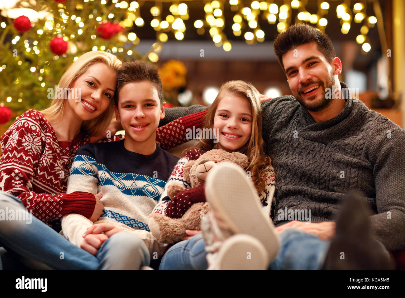 portrait of young smiling family on Christmas holiday Stock Photo