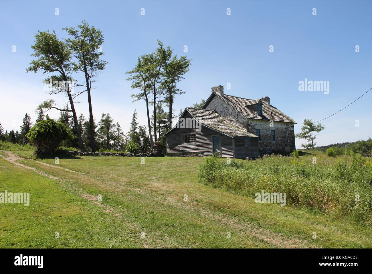 Old house in the fields of countryside with blue sky Stock Photo - Alamy