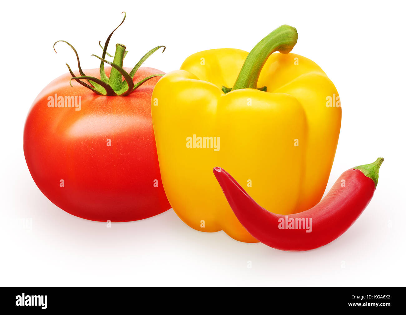 Whole fresh red tomatoe with green leaves, red chili and yellow bell pepper vegetables isolated on white background Stock Photo