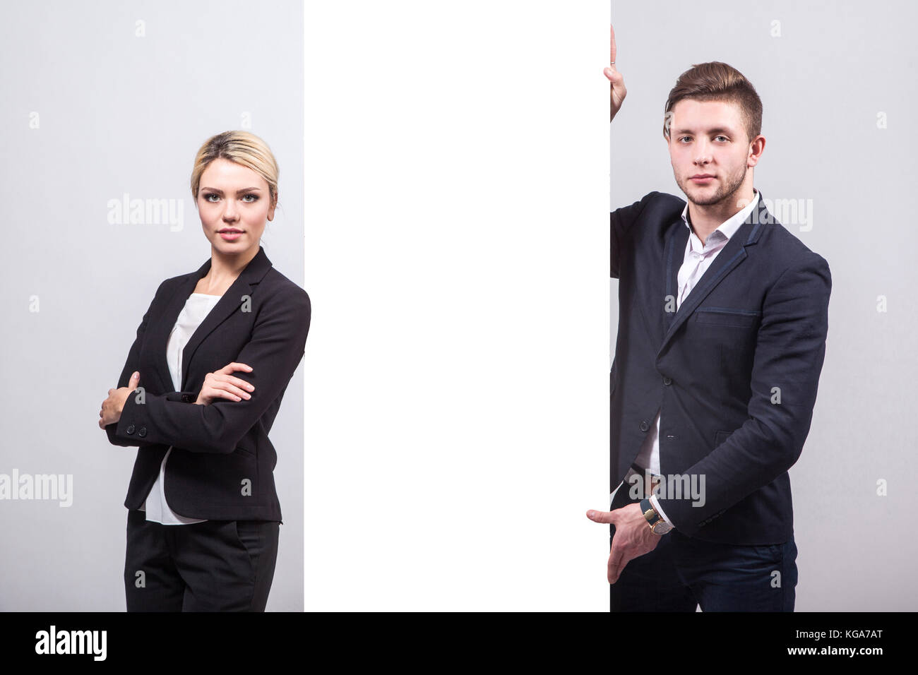 Two businessmen standing side by side hi-res stock photography and ...