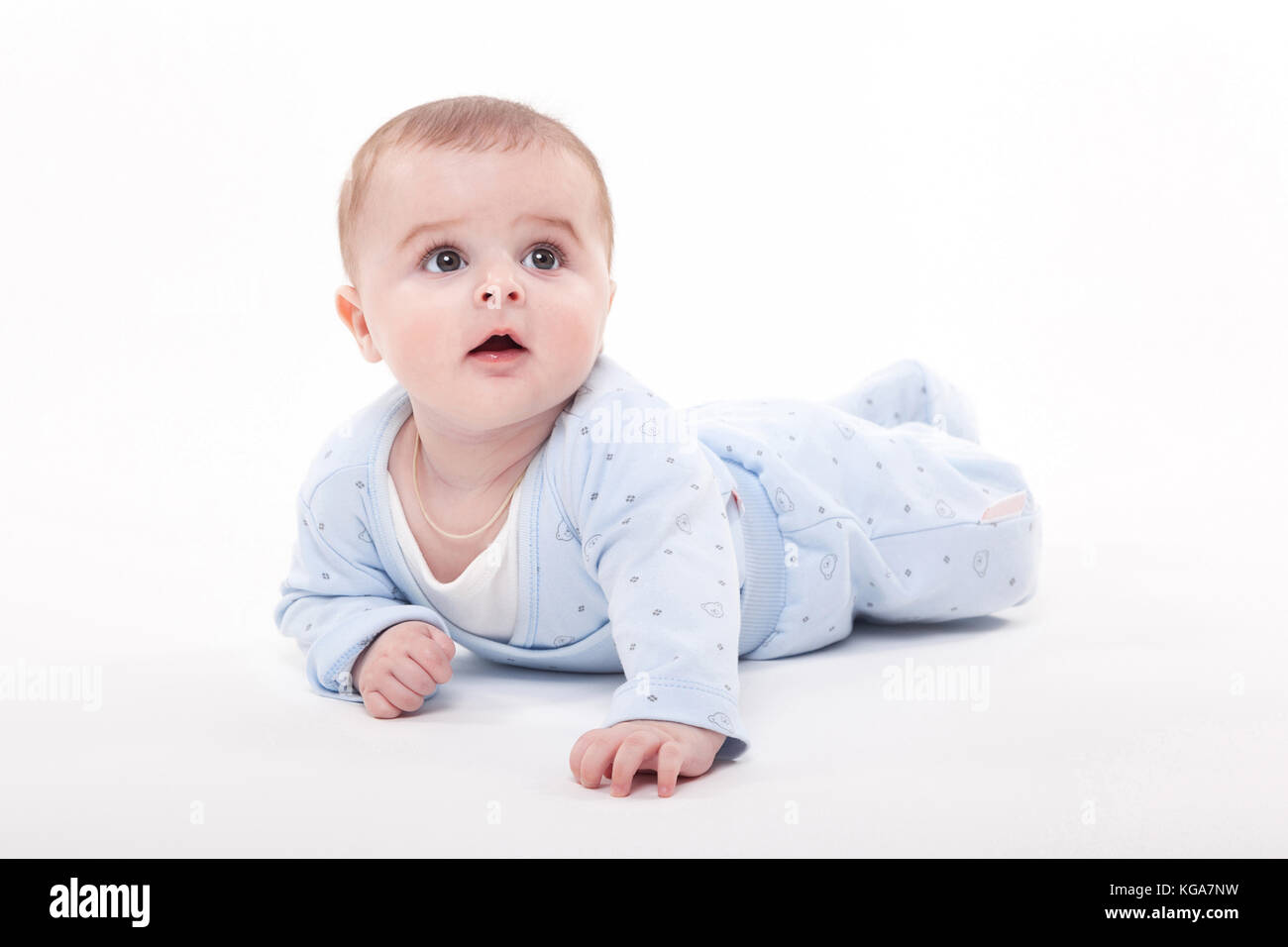 baby in the body lying on his stomach on a white background and Stock
