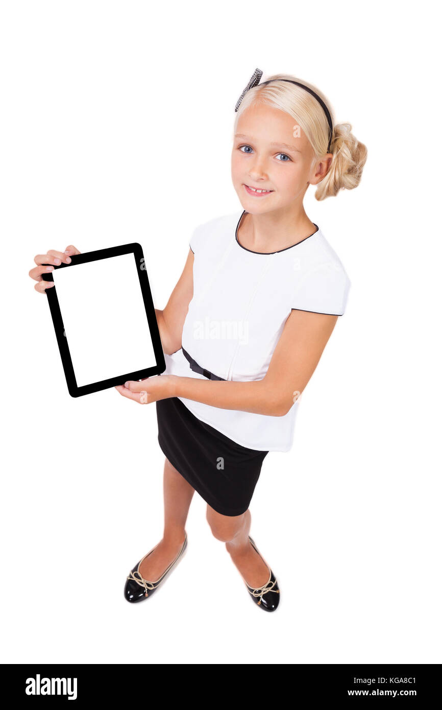 school girl with a tablet in hands looking at the camera and smi Stock Photo