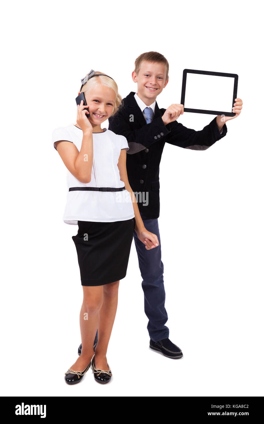 student with a tablet and a schoolgirl with a mobile phone on a  Stock Photo