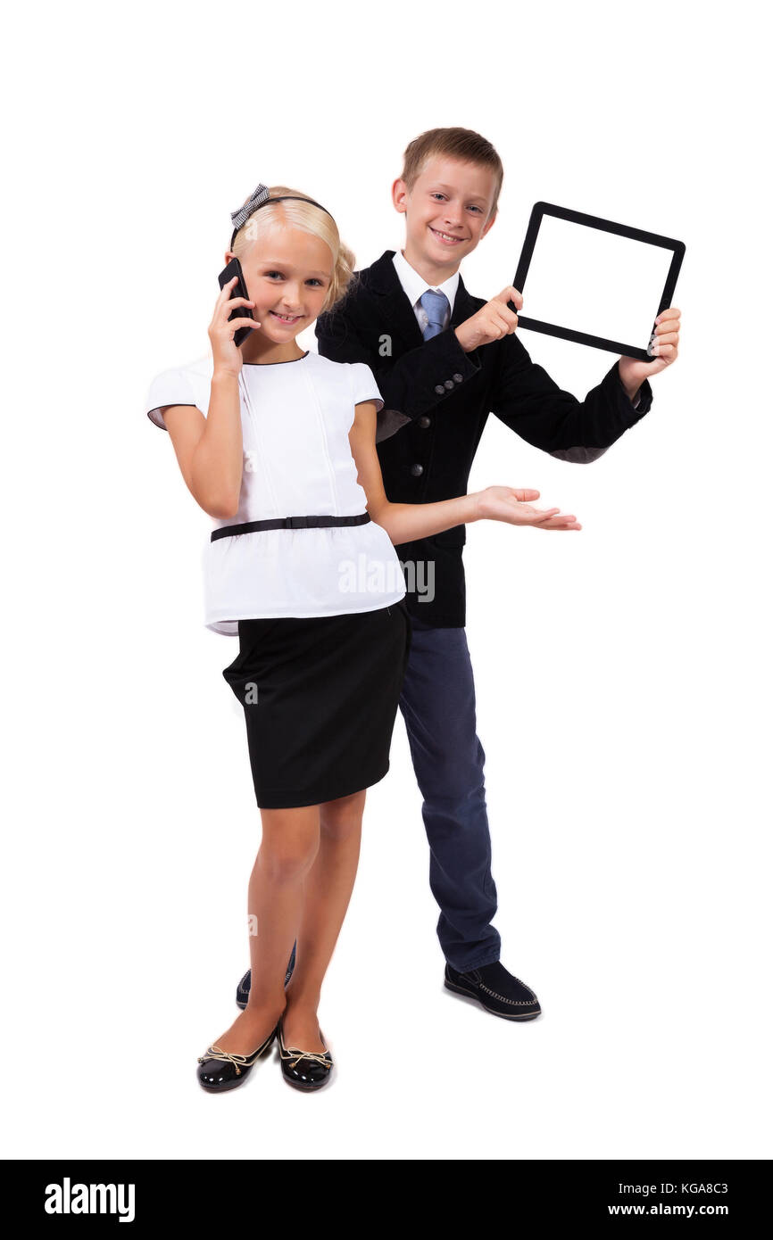 student with a tablet and a schoolgirl with a mobile phone on a  Stock Photo