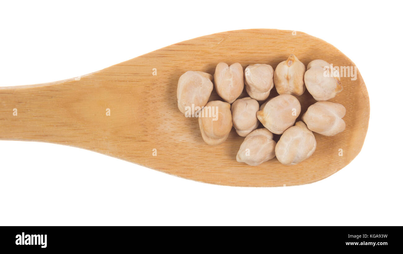 Cicer arietinum is cientific name of Chickpeas legume. Also known as Garbanzo bean, Chick Peas or Grao de Bico. Grains over wooden bamboo spoon. White Stock Photo