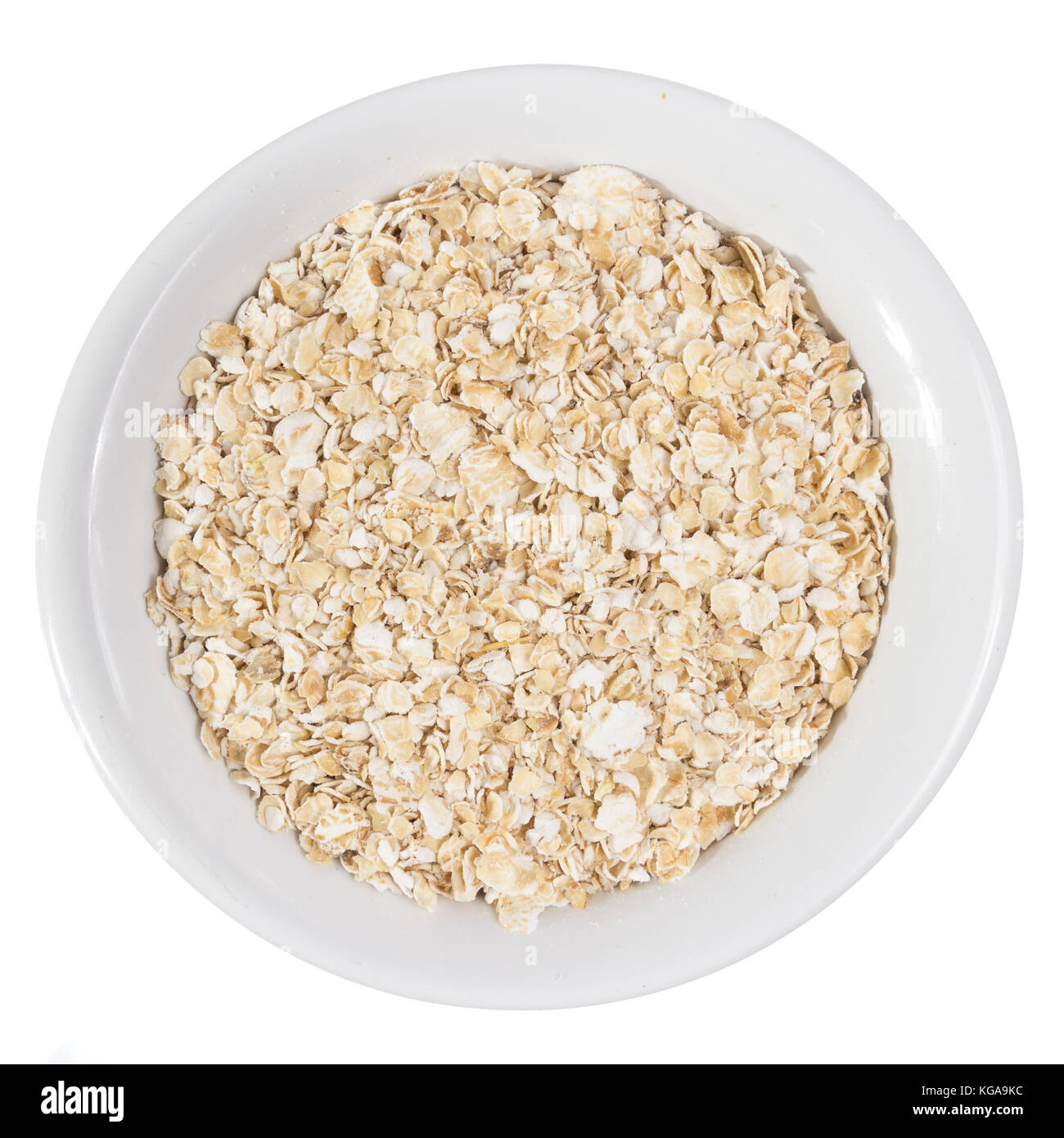 Avena Sativa is scientific name of Oat cereal grain. Also known as Aveia or  Avena. Top view of grains on ceramics bowl. Isolated Stock Photo - Alamy