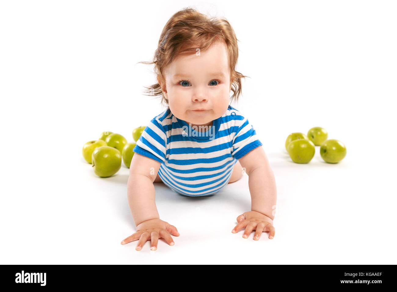 child in striped vest on the floor Stock Photo Alamy