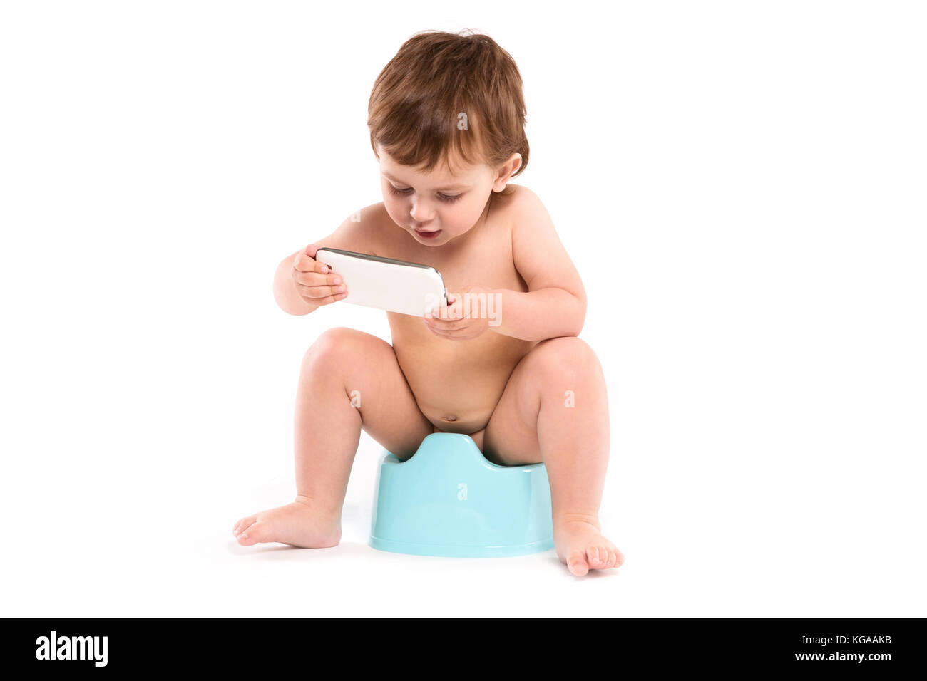 child sitting on the potty Stock Photo