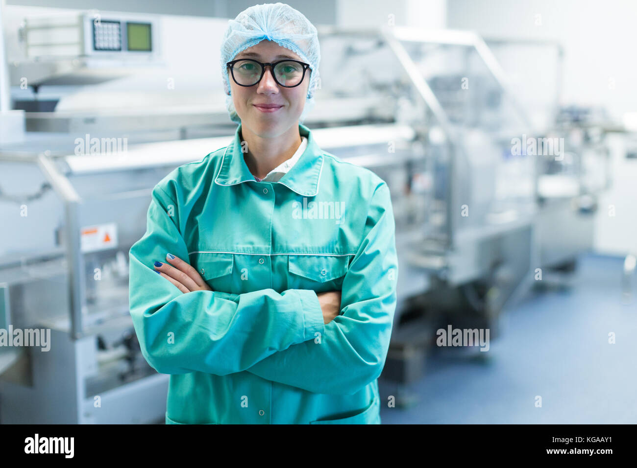 operator in the pharmaceutical factory near the equipment Stock Photo