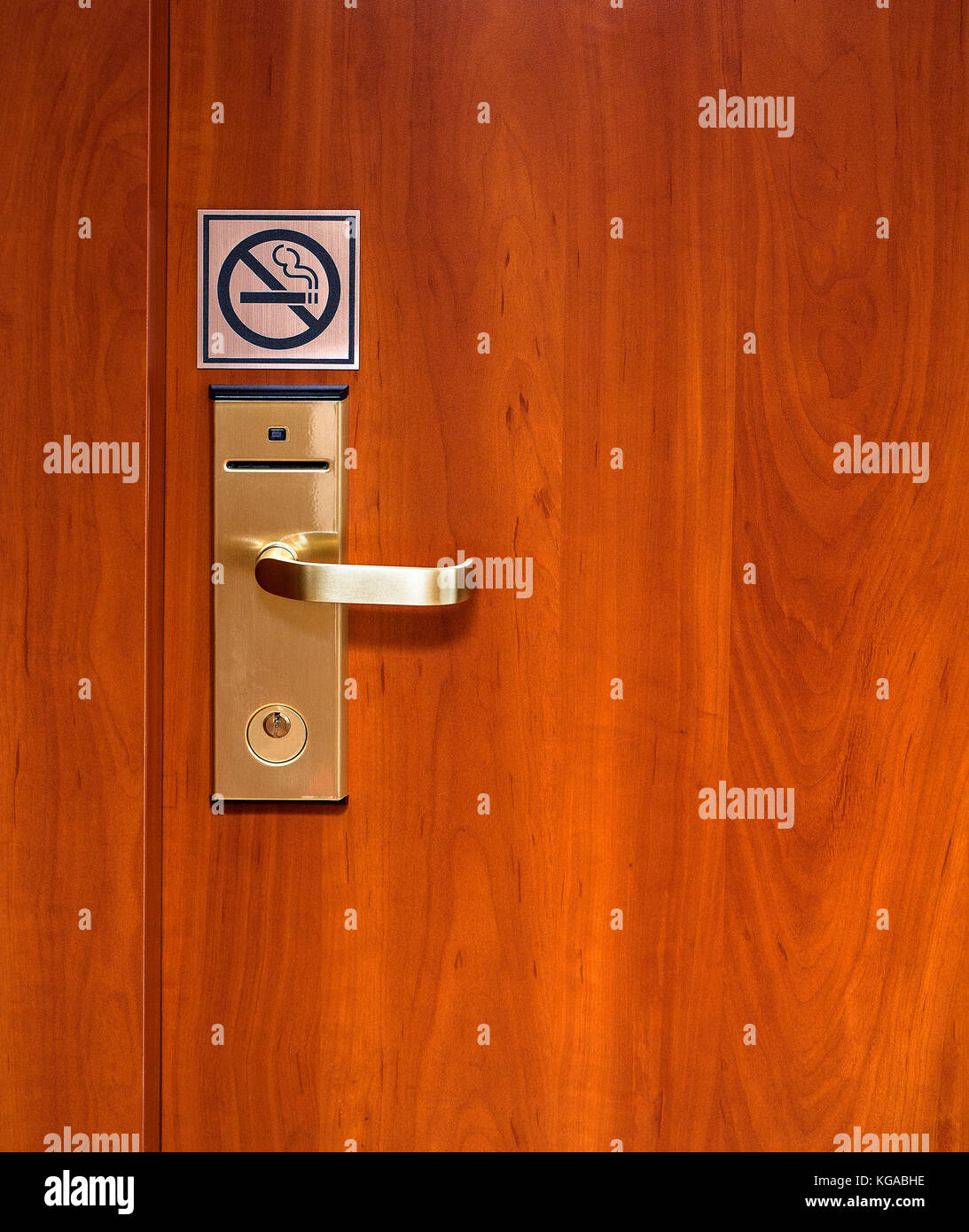 Hotel electronic lock on wooden door background Stock Photo