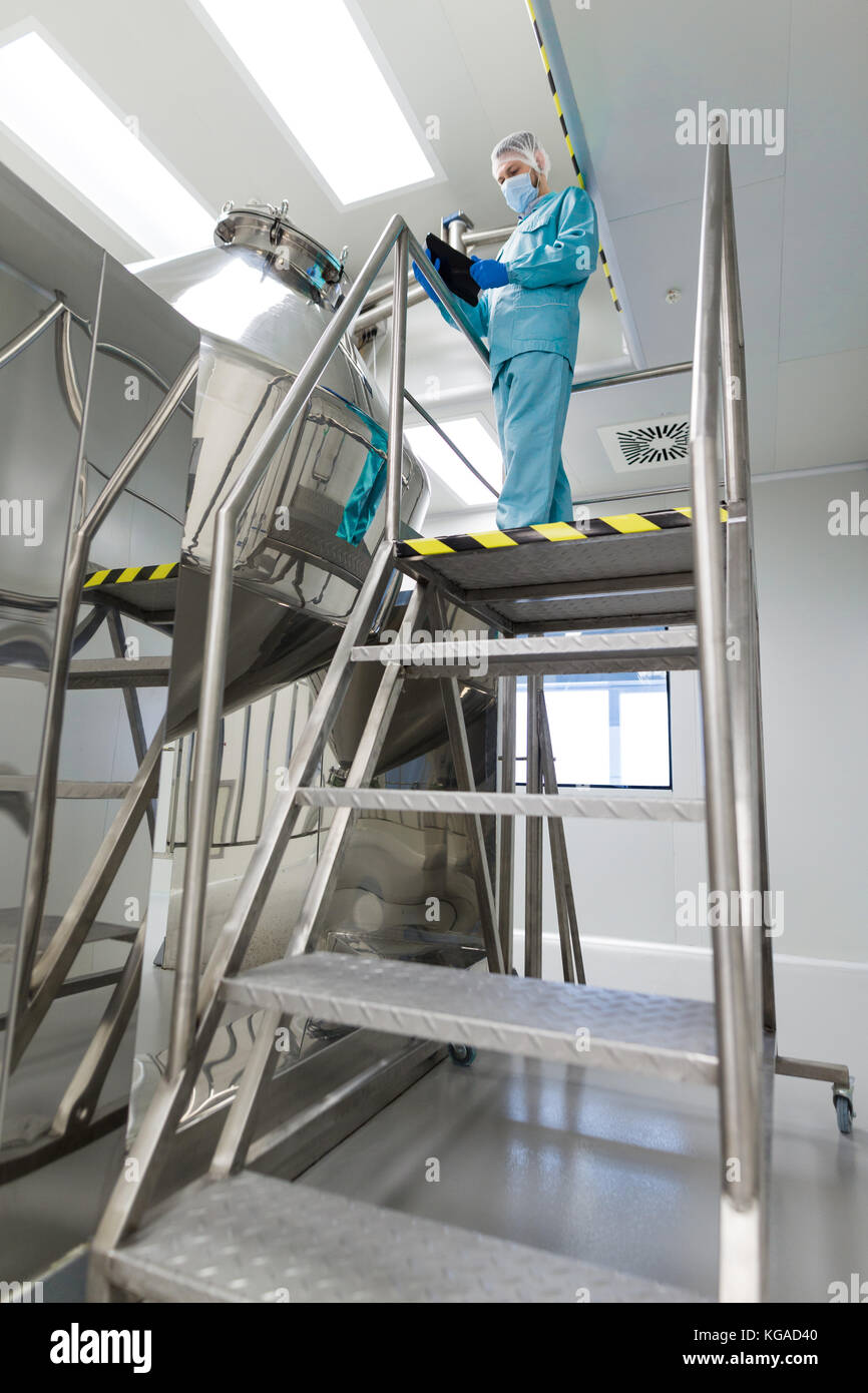 Scientist Make Notes About Big Metal Tank Stock Photo Alamy