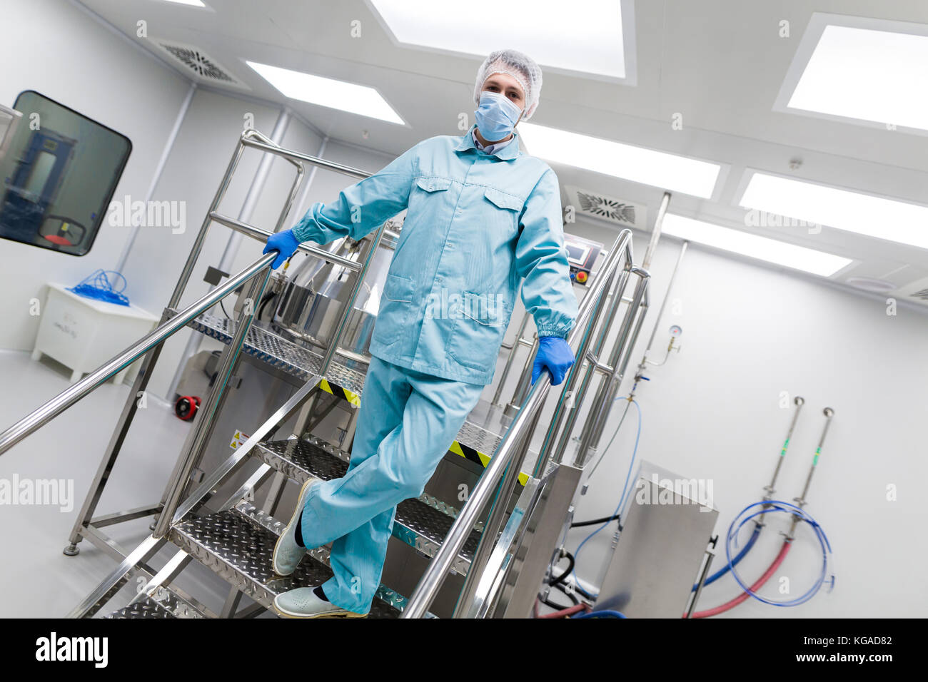 plant picture, scientist is standing on ladder in laboratory Stock Photo