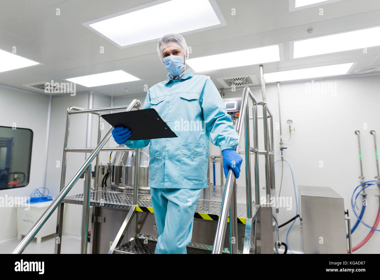 plant picture, scientist is standing on ladder in laboratory, ch Stock Photo