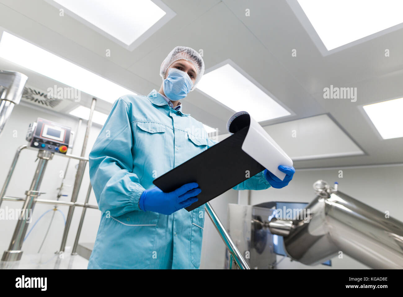 plant picture, scientist is standing on ladder in laboratory, ch Stock Photo