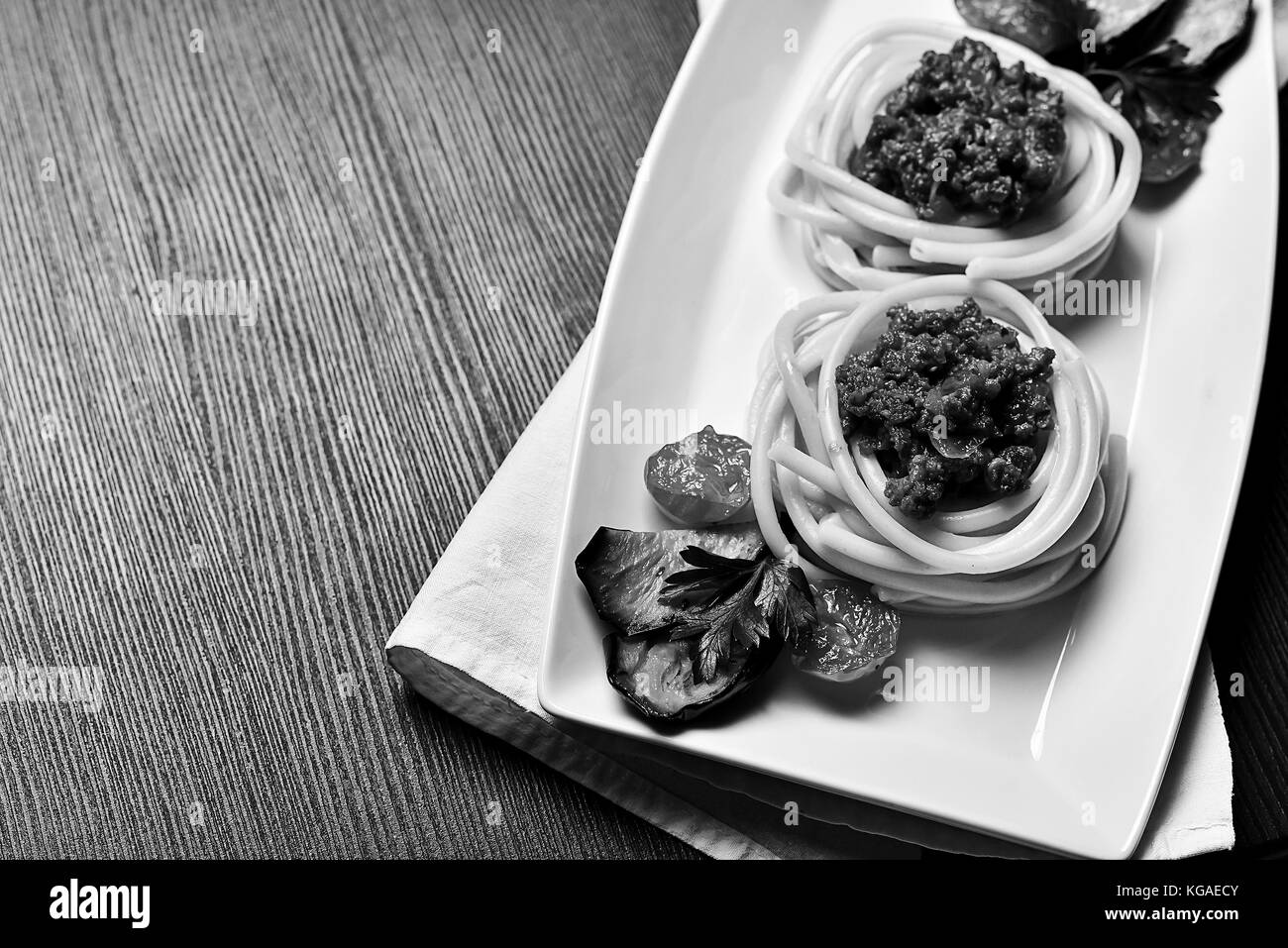 Italian pasta with meat on a plate in a cafe. Italian pasta with Stock Photo