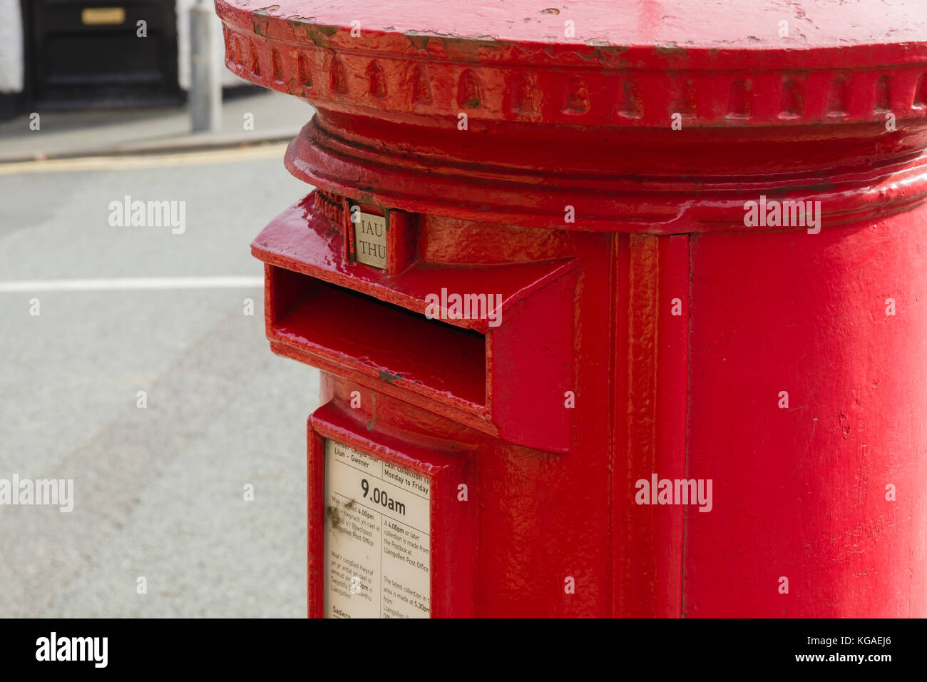 Classic style British red post box in Llangollen North Wales with