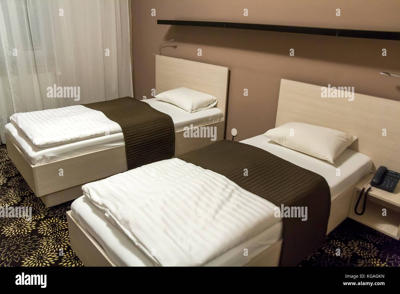 Hotel room interior with two comfortable beds Stock Photo Alamy