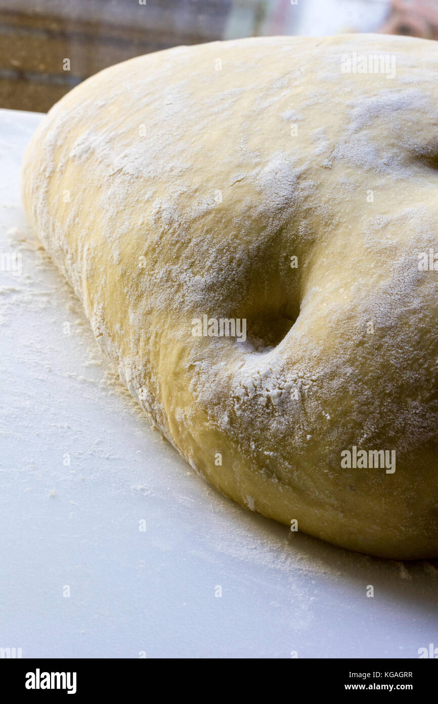 Yeasted dough will double in volume and become supple when ready to work Stock Photo