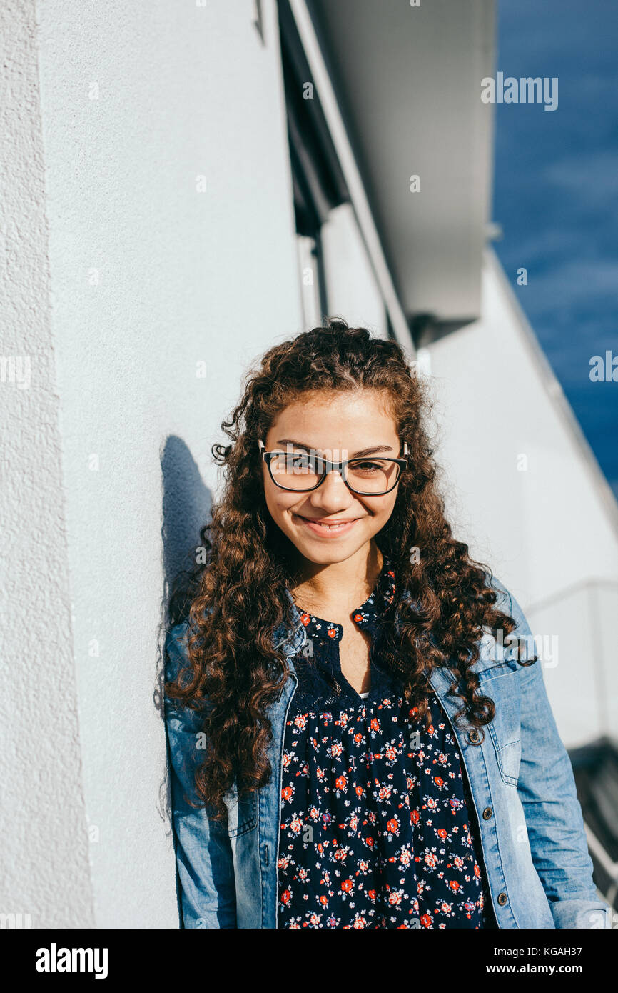 young beautiful woman with curly hair smiling Stock Photo - Alamy
