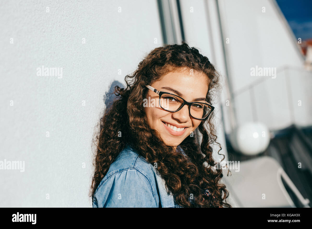 young beautiful woman with curly hair smiling Stock Photo - Alamy