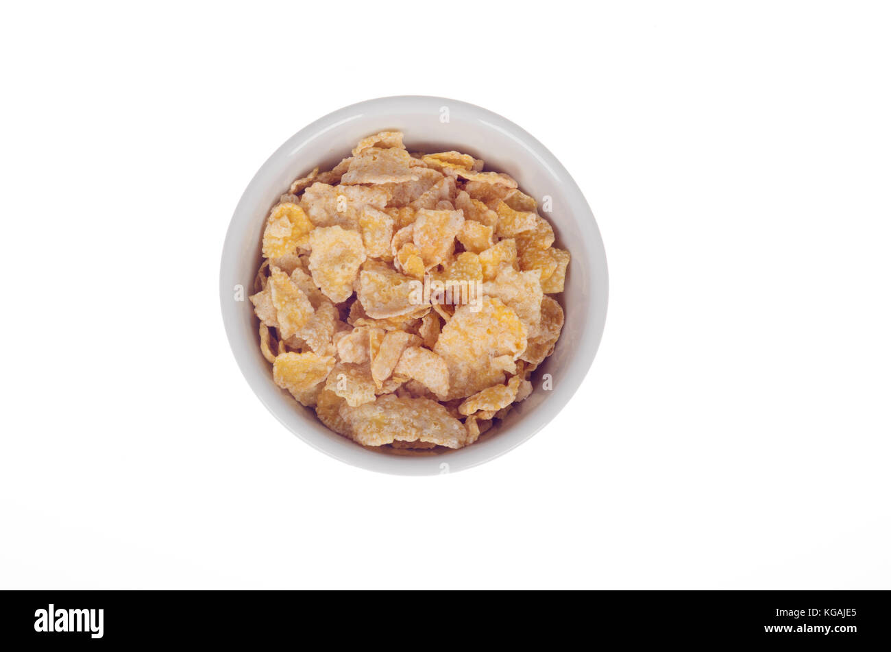 Bowl of Kellogg's Frosted Flakes or Frosties sugar coated corn flakes cereal in bowl isolated from above on white background Stock Photo