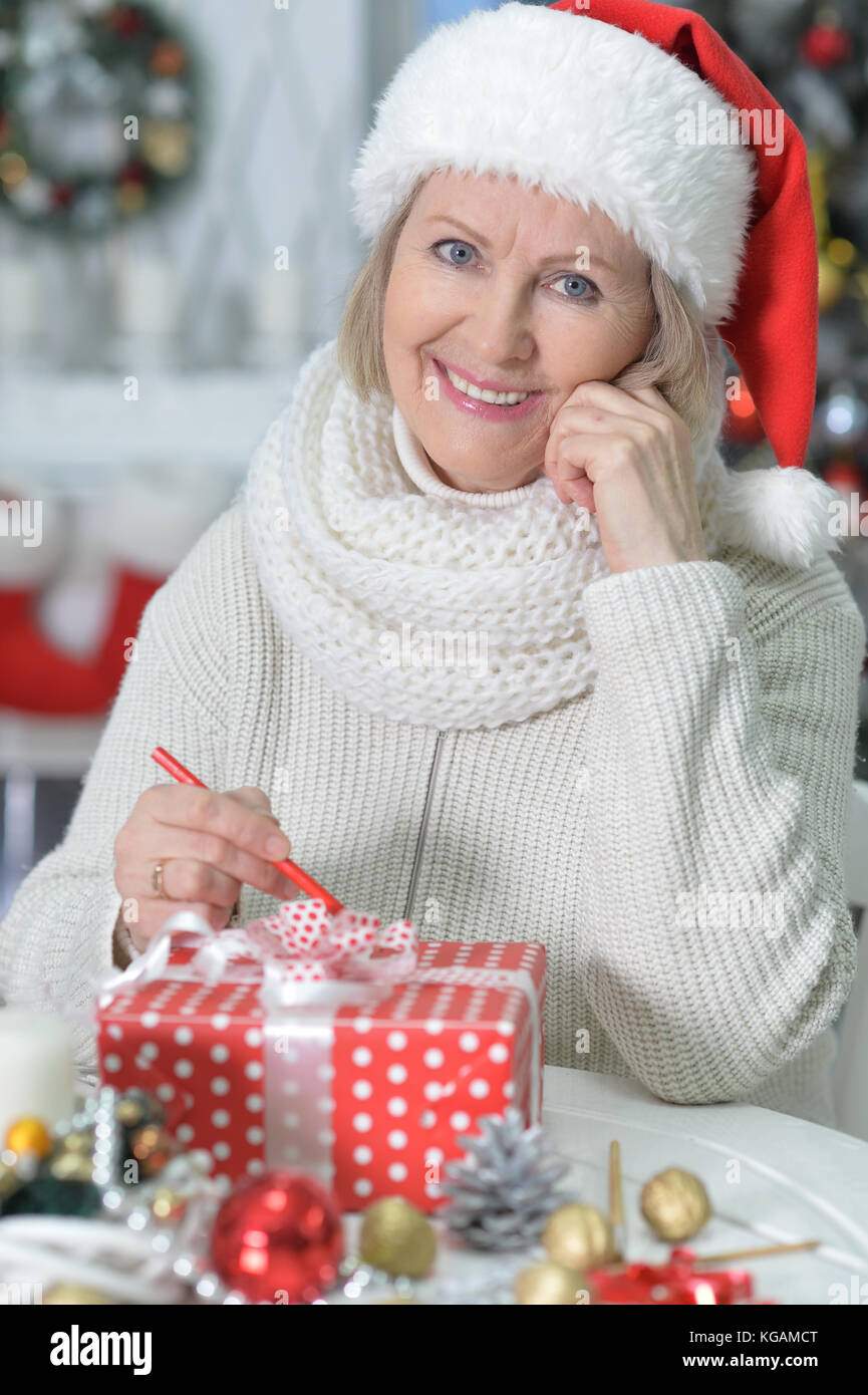 Mature woman purchasing christmas hi-res stock photography and images ...