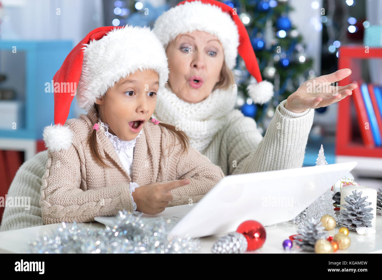 grandmother and her granddaughter using laptop Stock Photo - Alamy