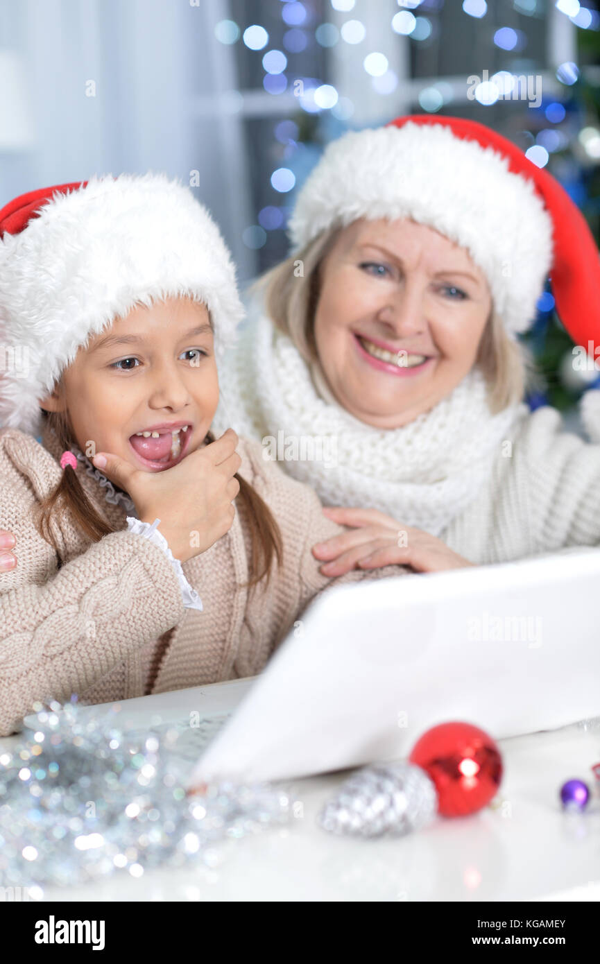 grandmother and her granddaughter using laptop Stock Photo - Alamy