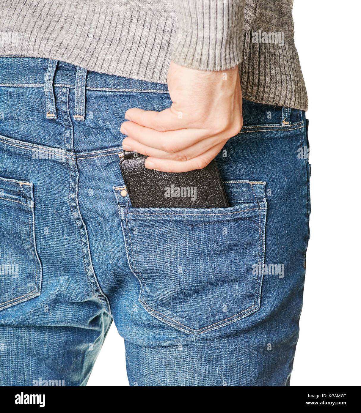 A man pulls out a black leather purse from his back pocket of jeans