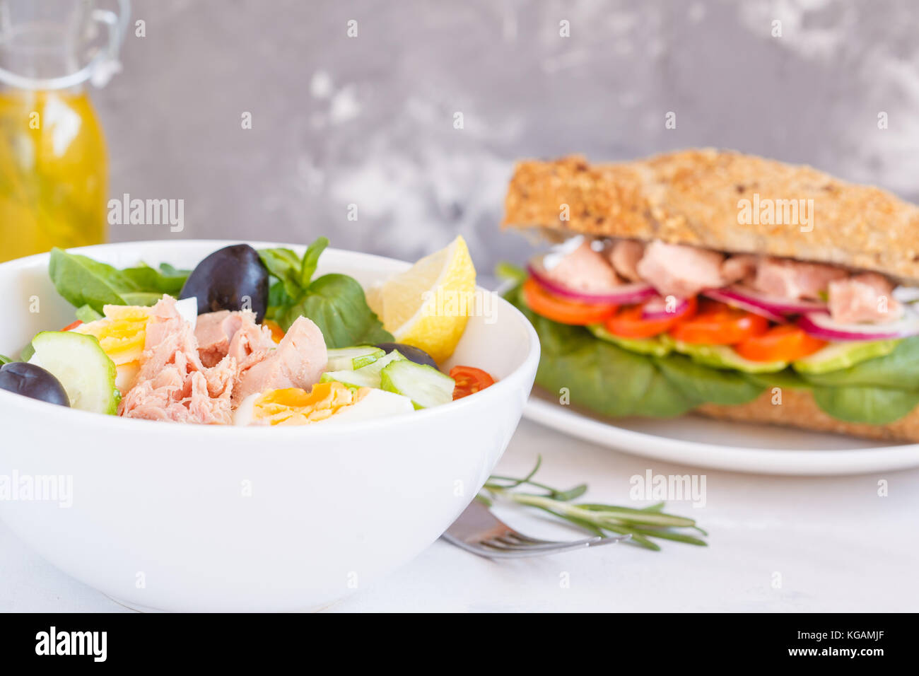 Tuna salad and tuna sandwich with vegetables, egg and olives Stock