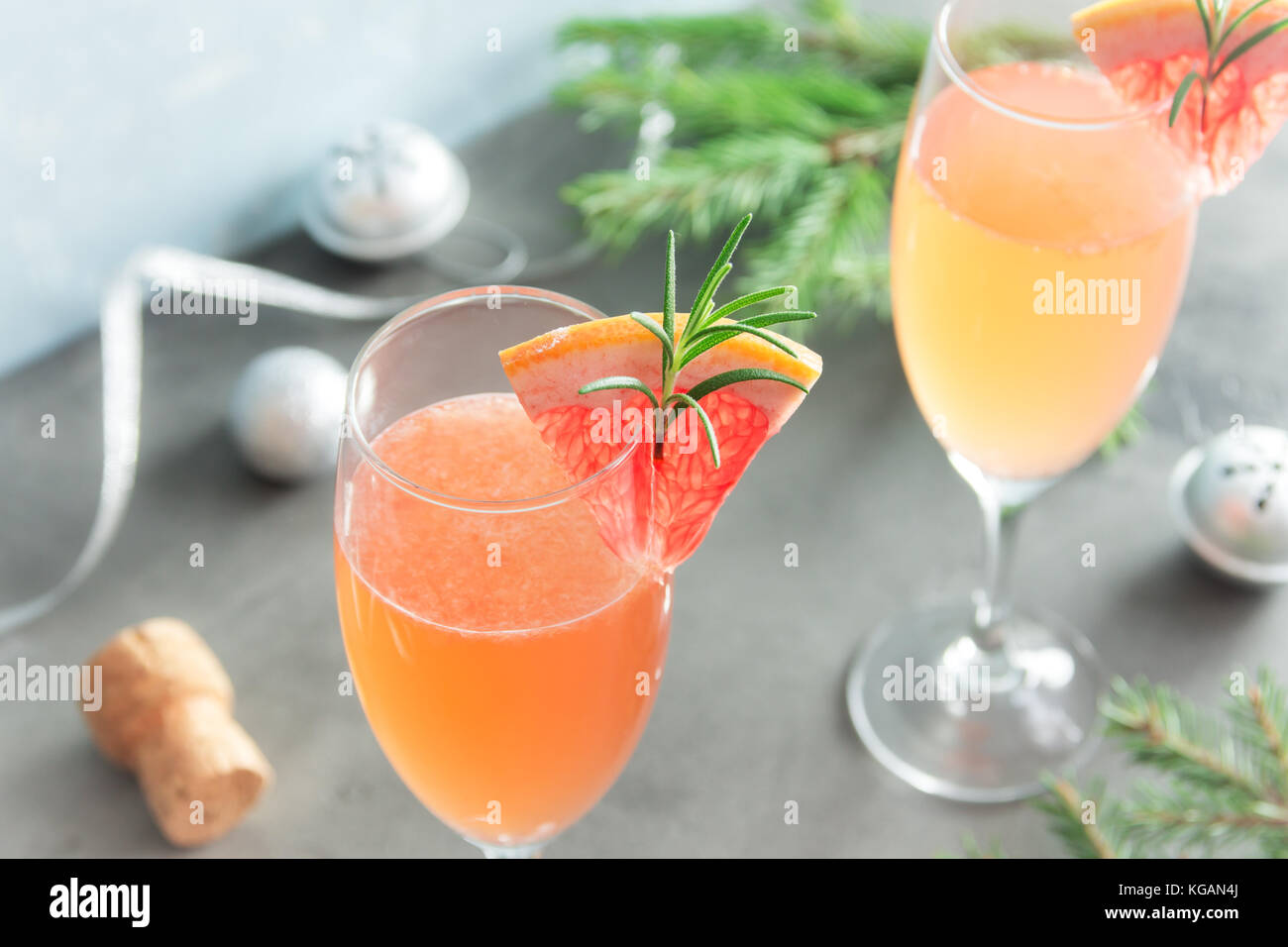 Mimosa festive drink for Christmas Champagne cocktail Mimosa with Grapefruit and Rosemary for