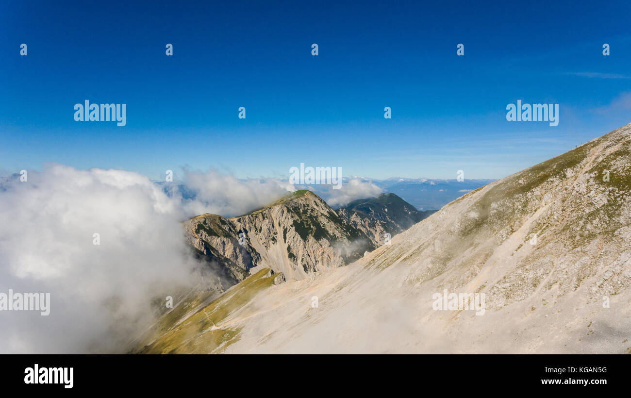 Cloud On Ridges Aerial view of mountain ridge surrounded with clouds Stock Photo - Alamy