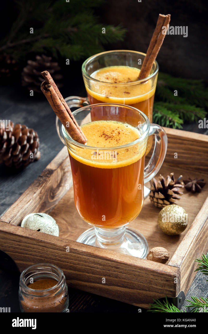 Hot buttered rum cocktail with cinnamon for Christmas and winter