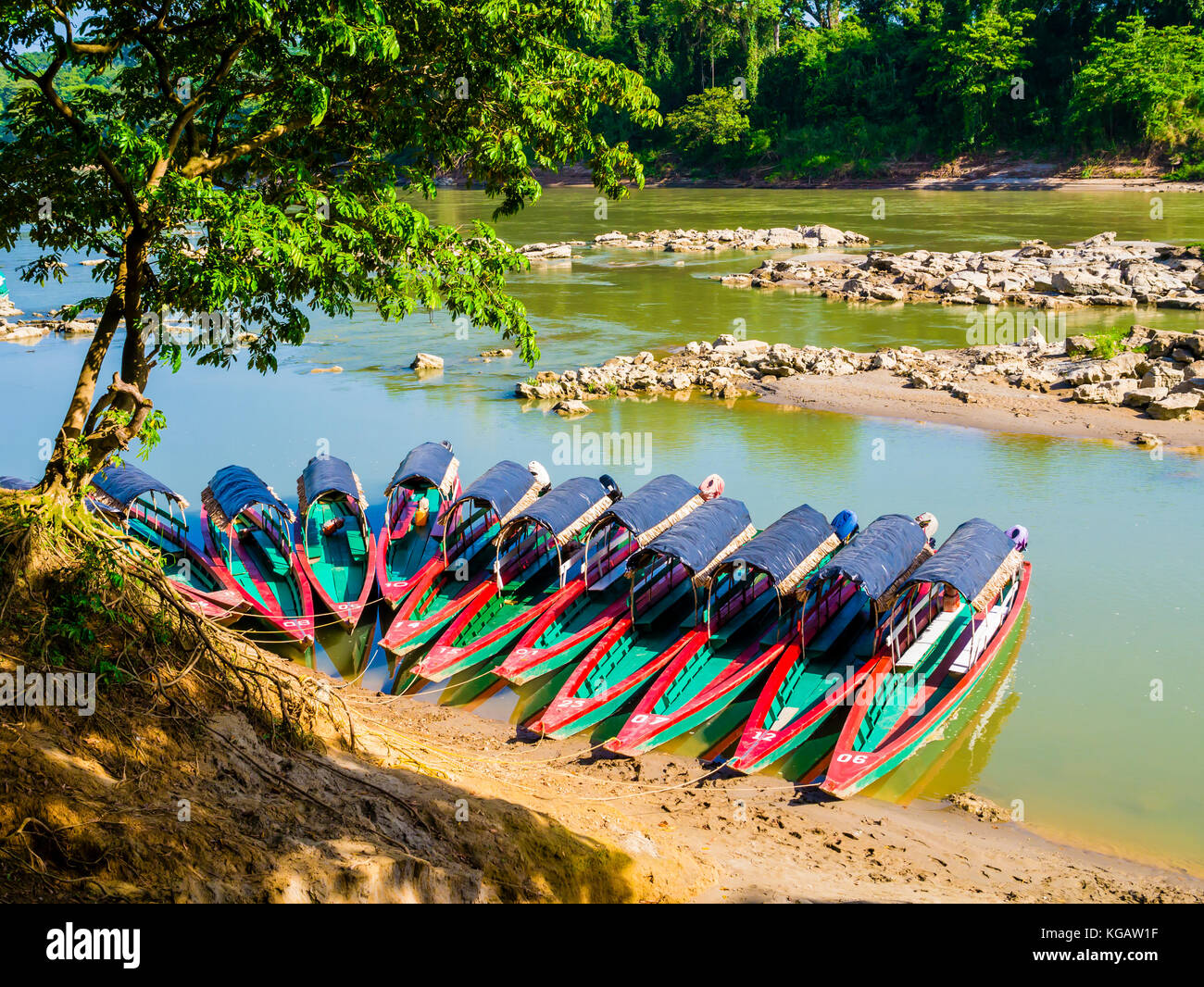 Tourist boats moored on Usumacinta river for Yaxchilan archaeological site, Chiapas, Mexico-Guatemala border Stock Photo