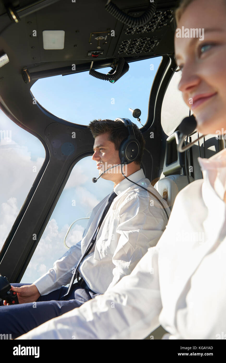 Pilot And Co Pilot In Cockpit Of Helicopter Stock Photo