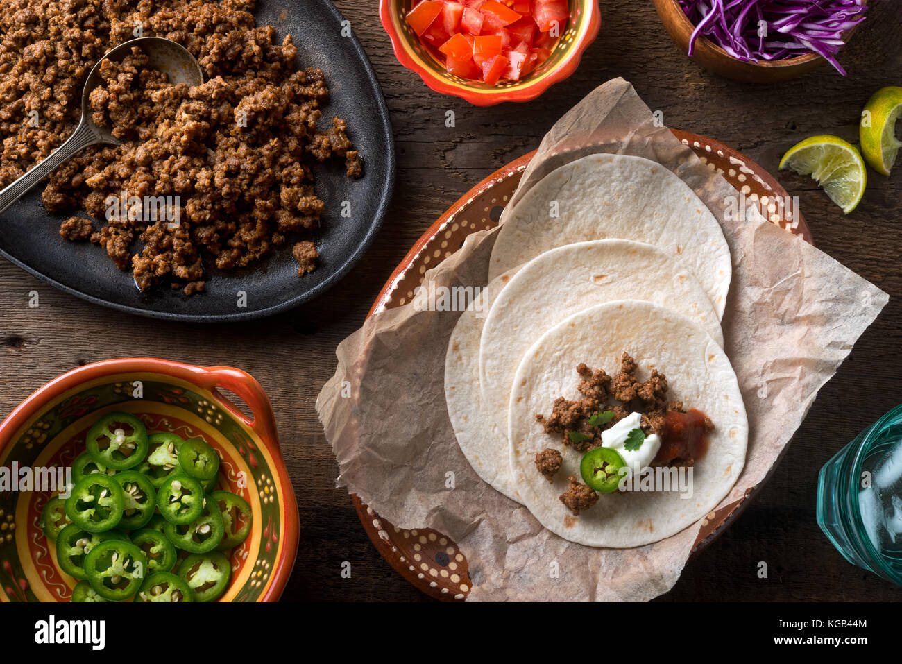Delicious ground beef tacos with jalapeno pepper, salsa, cilantro, sour