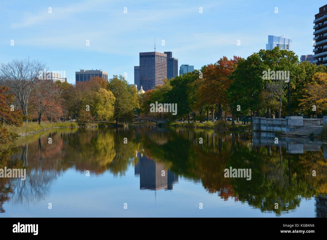 Reflection of the Boston Back Bay skyline in Autumn seen from the Charles River Esplanade Stock Photo