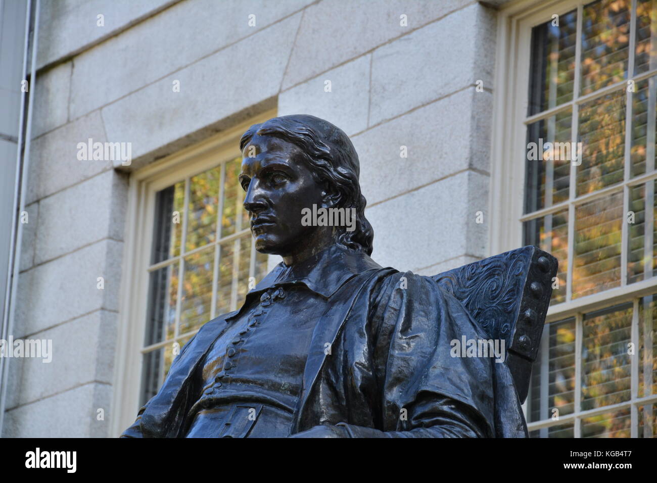 The famous John Harvard statue in Harvard Yard at Harvard University in
