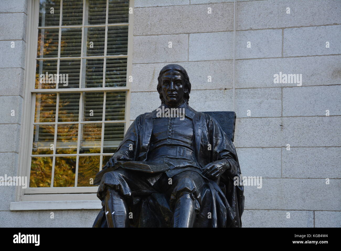 The famous John Harvard statue in Harvard Yard at Harvard University in